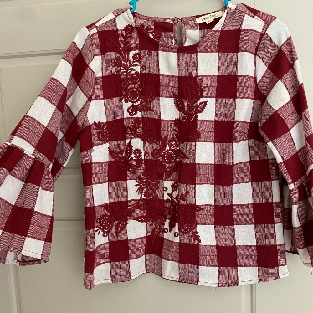 Red floral blouse.